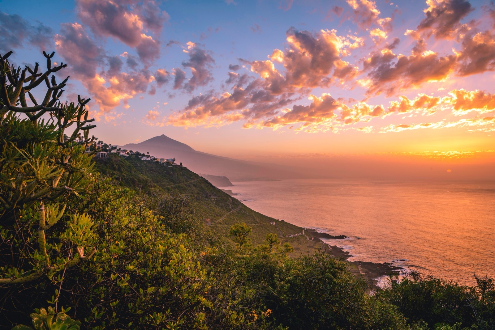 Sunset over the Tenerife north coast with Mount Teide silhouetted on the horizon